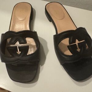 Gucci black flat leather sandals